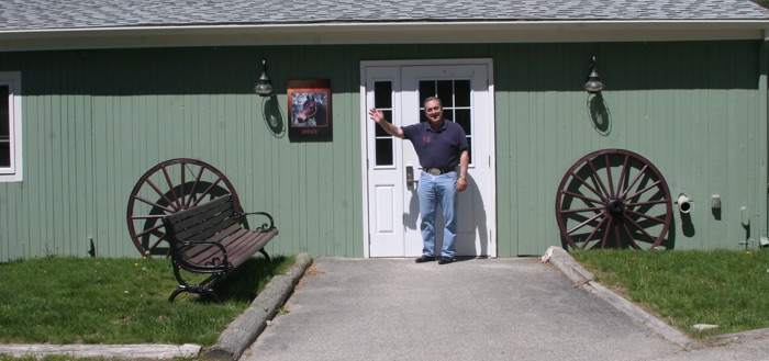 Chrislar barn entry with Larry Cassenti at the door giving a welcoming wave